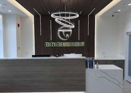 Modern dental front desk and reception area at DNTL SPOT in Hewlett, NY.