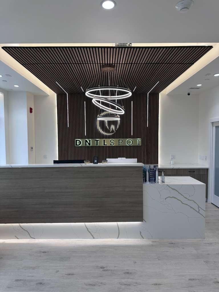 Modern dental front desk and reception area at DNTL SPOT in Hewlett, NY.